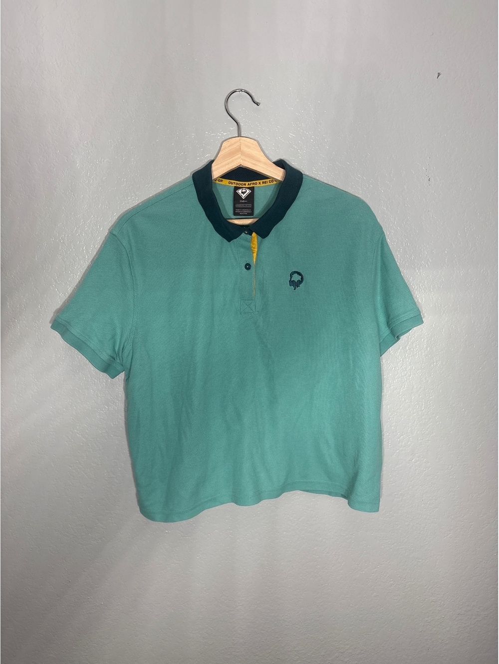 Outdoor Afro REI collab collegiate  croppped polo rugby